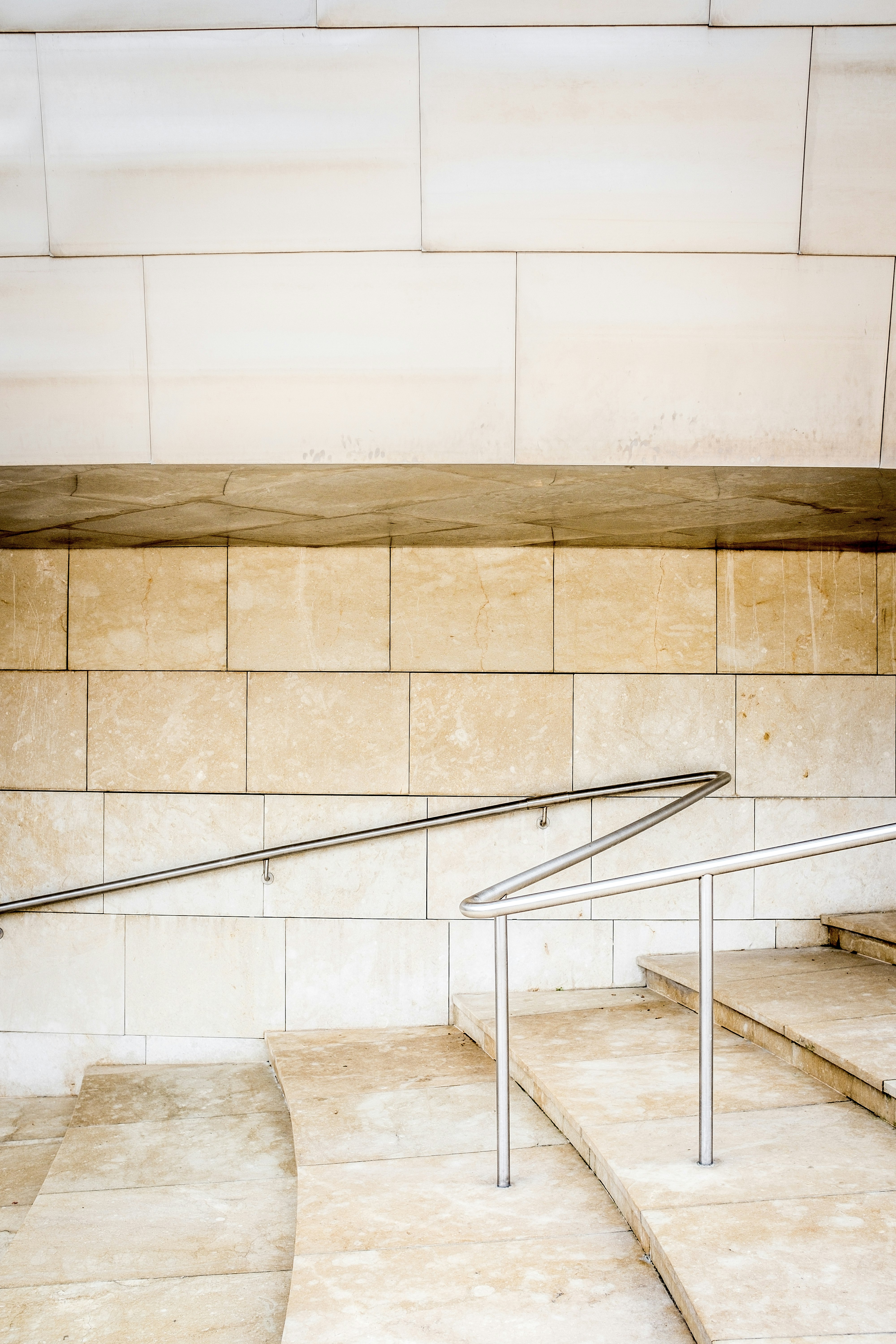 silver handrail on stairs